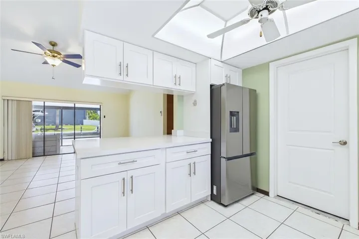 Kitchen has full stove, refrigerator, microwave and dishwasher.