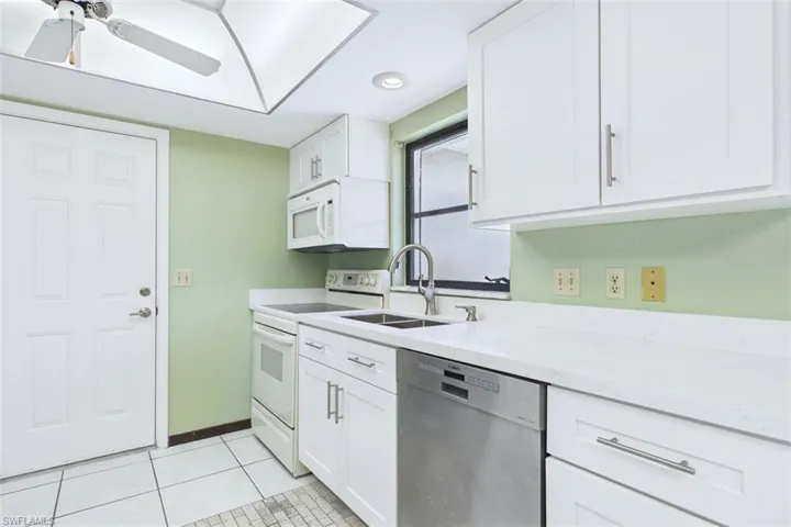 Kitchen has full stove, refrigerator, microwave and dishwasher.