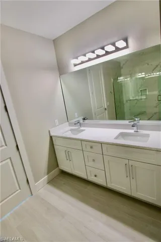 Bathroom featuring vanity and walk in shower
