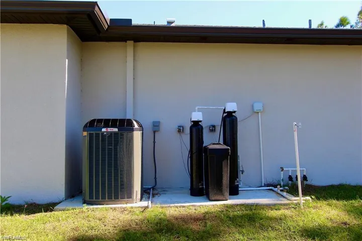 View of side of property featuring central AC