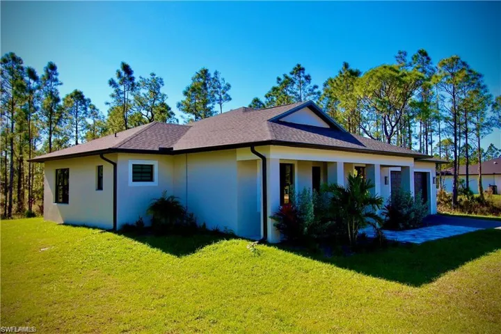 View of home's exterior with a lawn