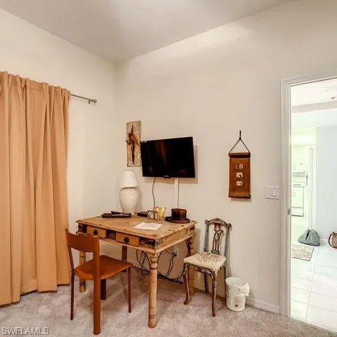 Home office with tile patterned flooring