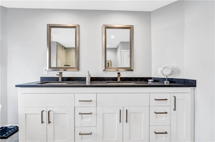 Main Bathroom with Beautiful white cabinets with dual sinks