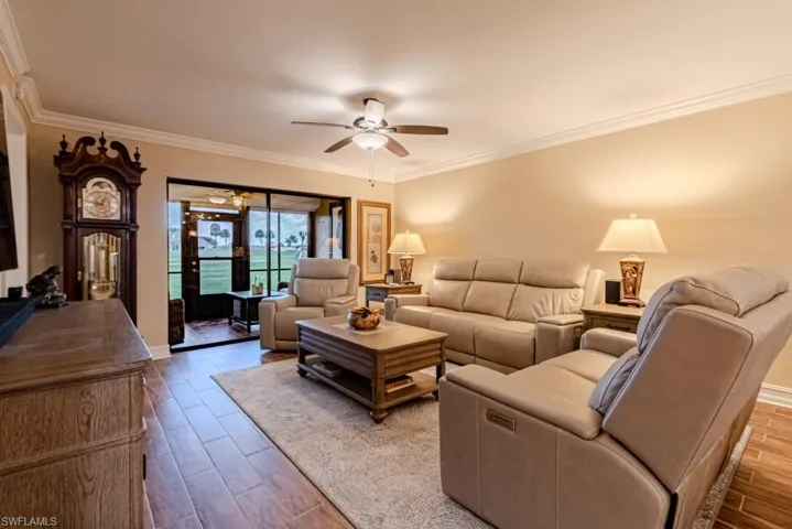 Living room with crown molding.