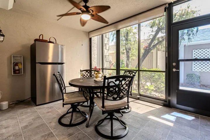Entry lanai with roll down shades and high end acrylic sliders with screens.