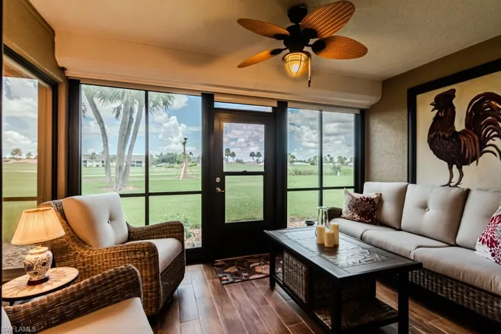 Sunroom featuring a healthy amount of sunlight and ceiling fan