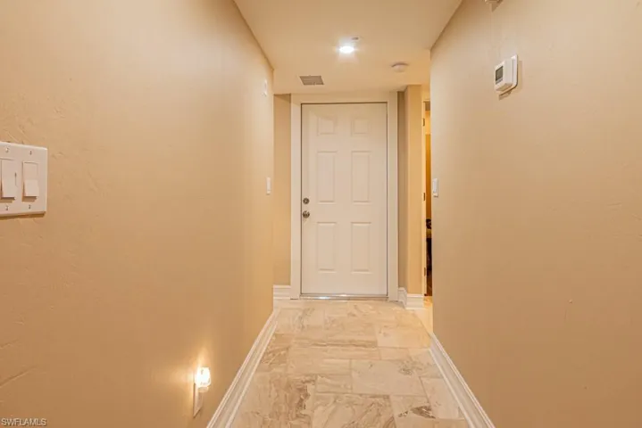 Entry with Travertine flooring.