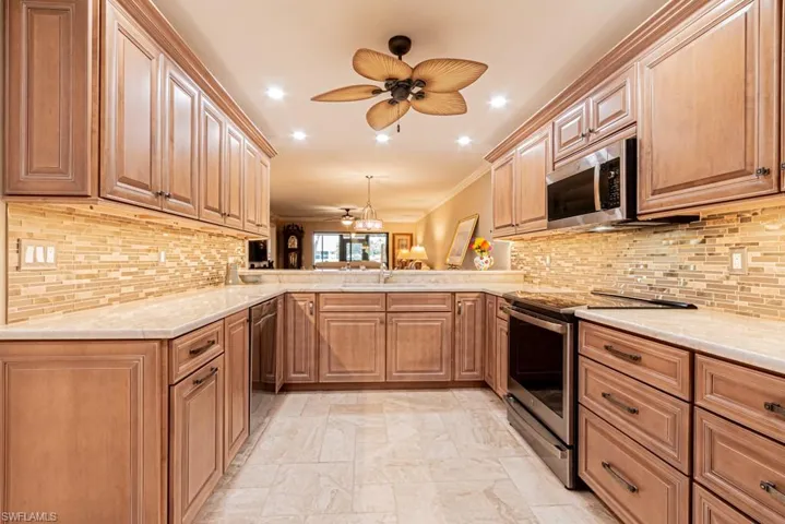 Kitchen with undercounter LED lights and Travertine floors