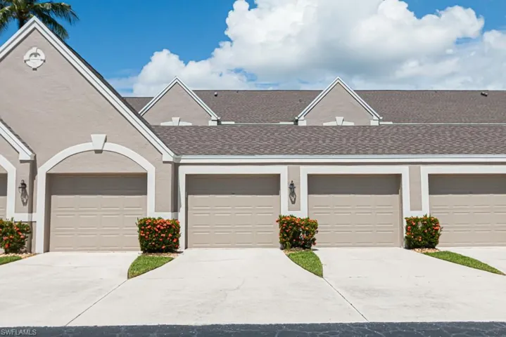 Front of garage with parking area in front.