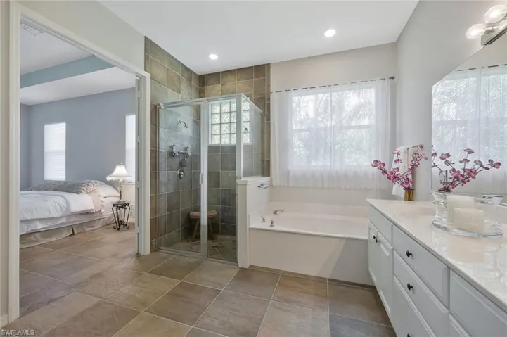 French Doors to your Primary Bathroom with Walk-In Shower and Large Soaking Tub