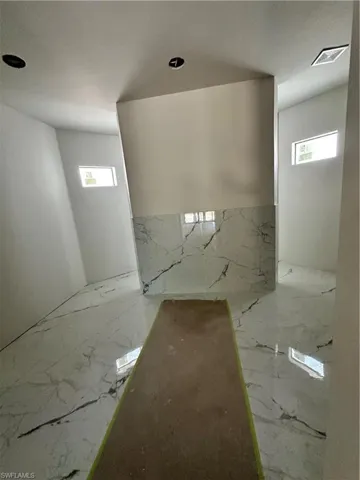 Master suite walking shower wall