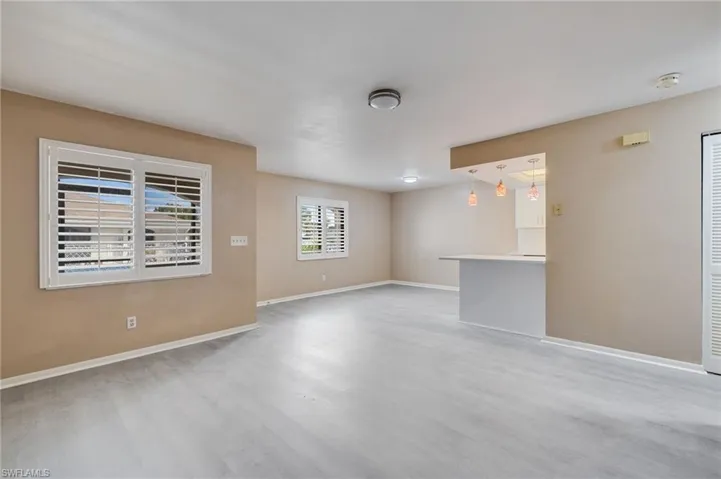 Unfurnished room featuring light wood-type flooring