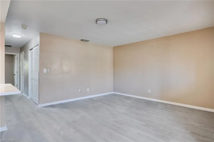 Unfurnished room with baseboards and light wood finished floors