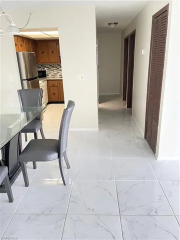 Corridor with light tile floors