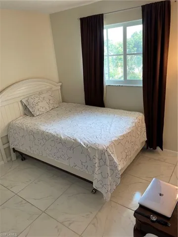 Bedroom with tile flooring