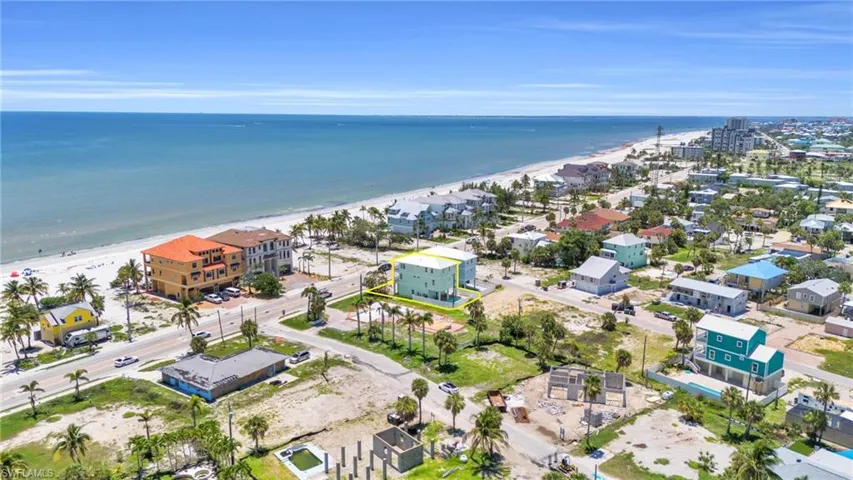 Aerial view with a water view and a view of the beach