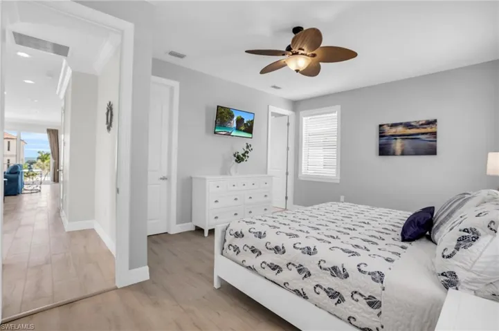 Bedroom featuring light hardwood / wood-style floors and ceiling fan