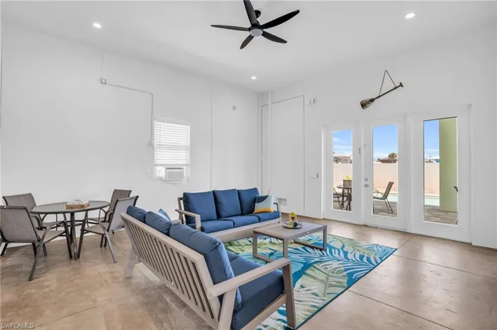 Living room with french doors and ceiling fan