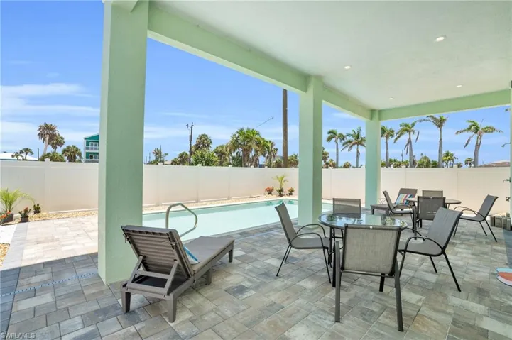 View of patio / terrace with a fenced in pool