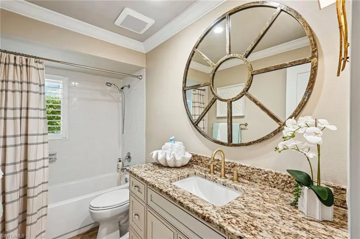White subway tile shower surround with fixed tub