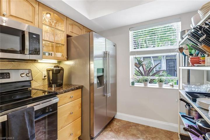 Kitchen has coffered ceiling, window allows for lots of natural light