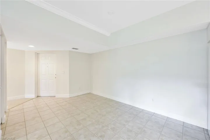 Dining room is just off the kitchen. Notice the cove ceilings.