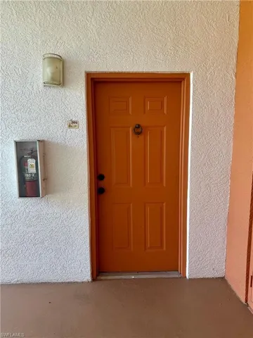 Property entrance featuring stucco and entrance light