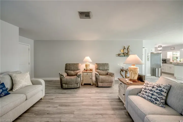 Living room featuring light hardwood / wood-style floors and sink