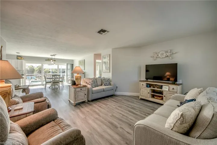 Living room with light wood-type flooring