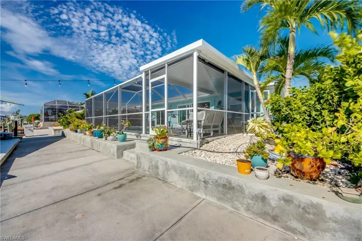 Back of property featuring a patio area and a lanai
