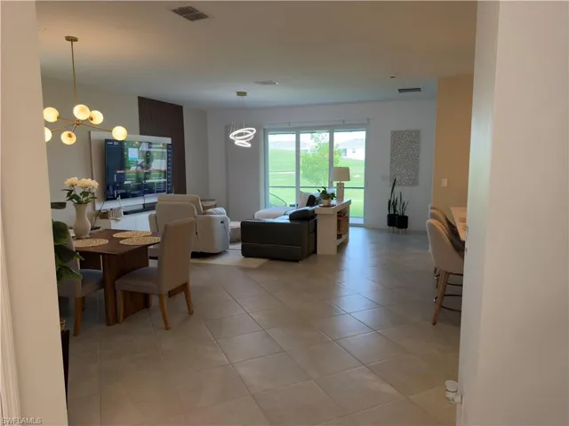 View of dining area, living room, and kitchen