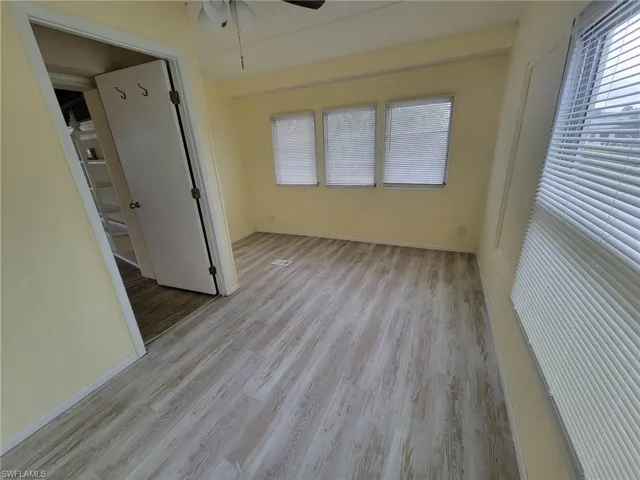 Unfurnished bedroom with light wood-style flooring and baseboards