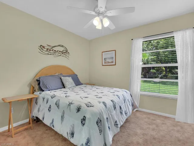 Bedroom featuring carpet flooring and ceiling fan