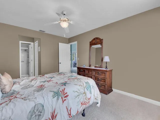 Bedroom with carpet flooring, a ceiling fan, and a closet