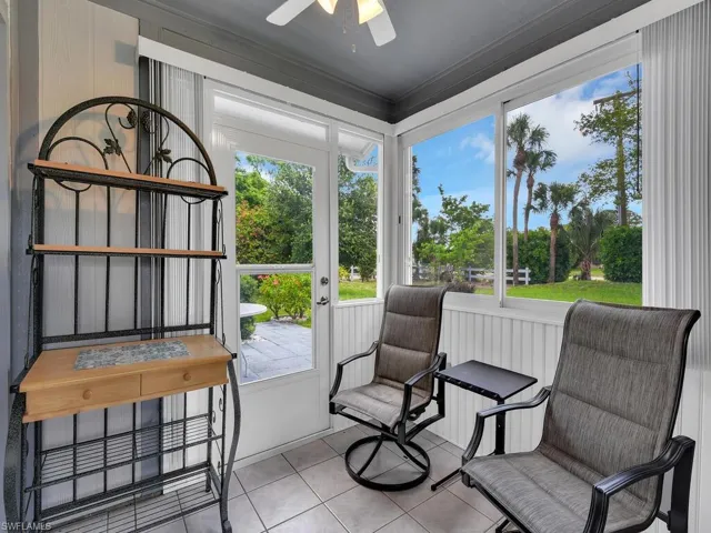 Sunroom / solarium featuring ceiling fan