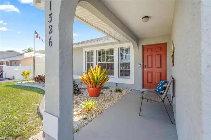 Property entrance with a lawn