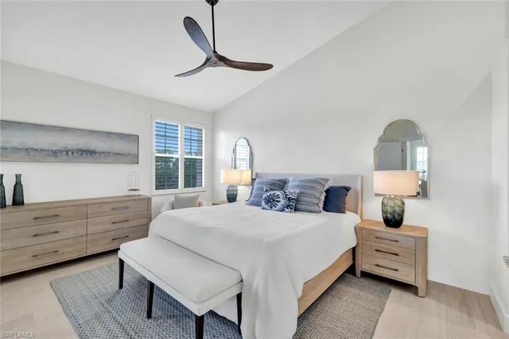 Primary bedroom with plenty of space and vaulted ceilings.