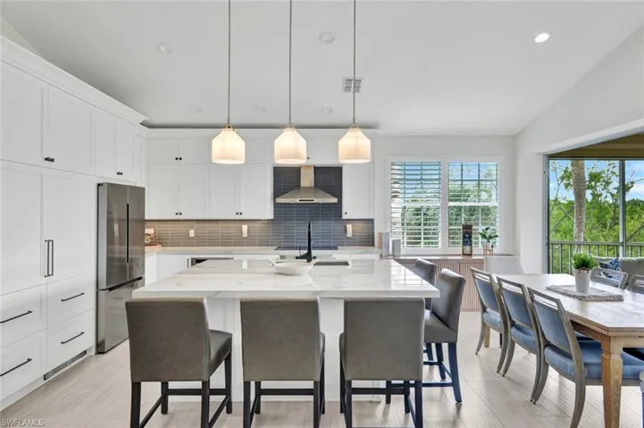 The kitchen island hosts seating for five.