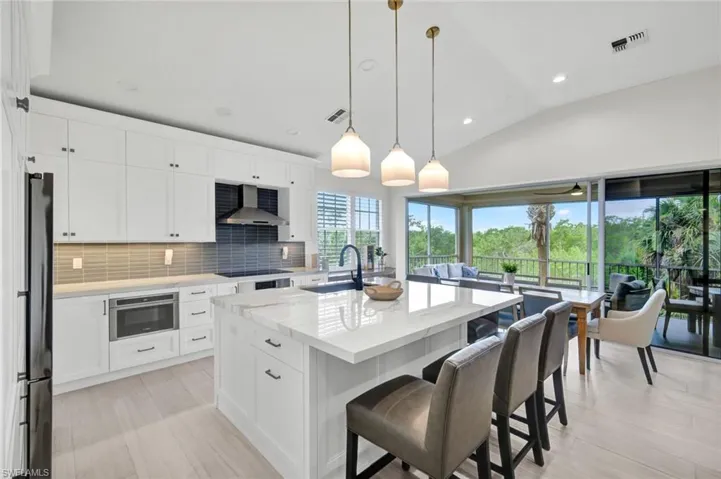 Stunning kitchen open to living dining, and outdoor space.
