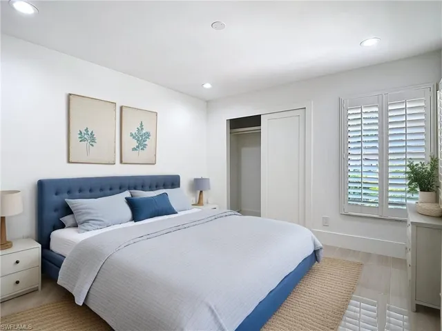 Bedroom with recessed lighting, a closet, and light wood finished floors