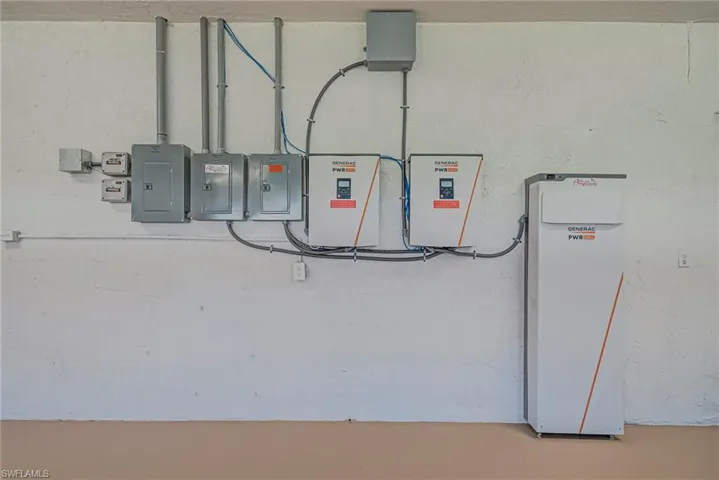 Utilities featuring solar system panel in the garage