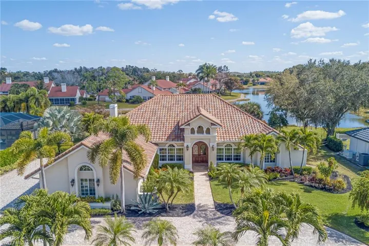 View of front of property featuring stucco siding and a tile roof