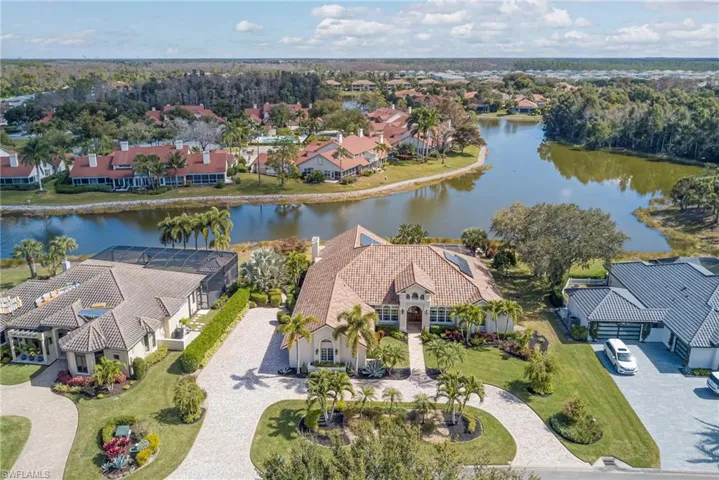 Aerial perspective of suburban area with a large body of water