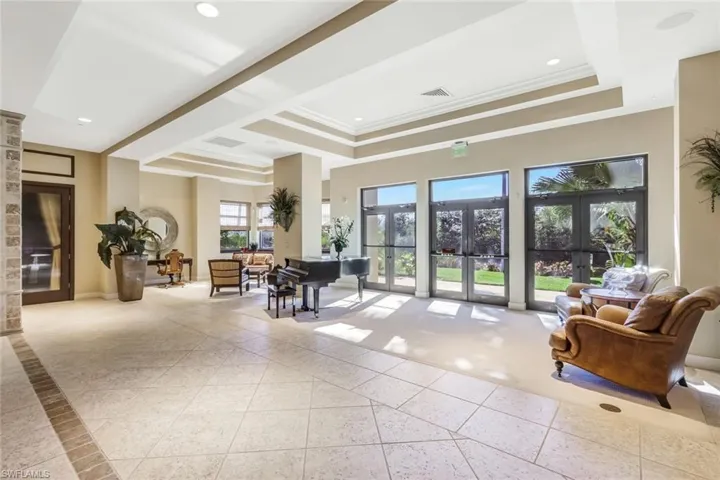 Common area featuring crown molding, a tray ceiling, and recessed lighting