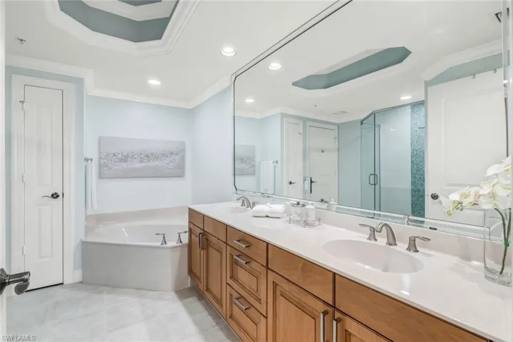 Primary bathroom with double sinks, shower and soaking tub.