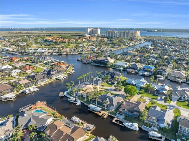 Aerial perspective of suburban area with a nearby body of water