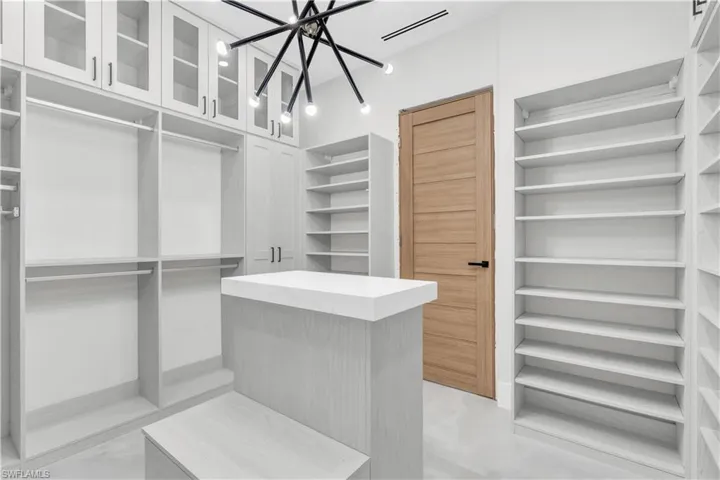 Bedroom featuring a tray ceiling, recessed lighting, and ceiling fan