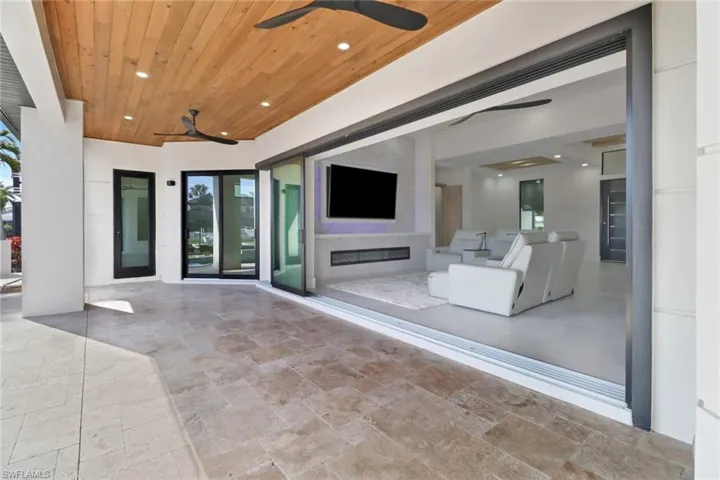 Doorway to outside featuring a water view and baseboards