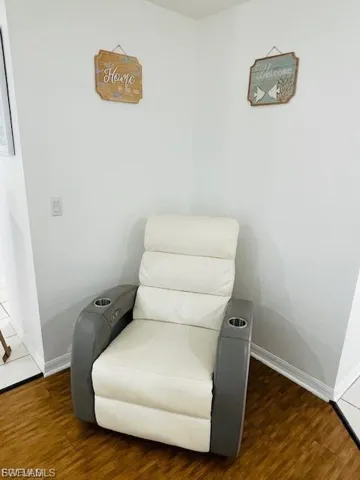 Sitting room featuring wood finished floors