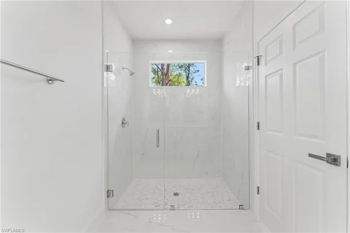 Full bathroom featuring a marble finish shower